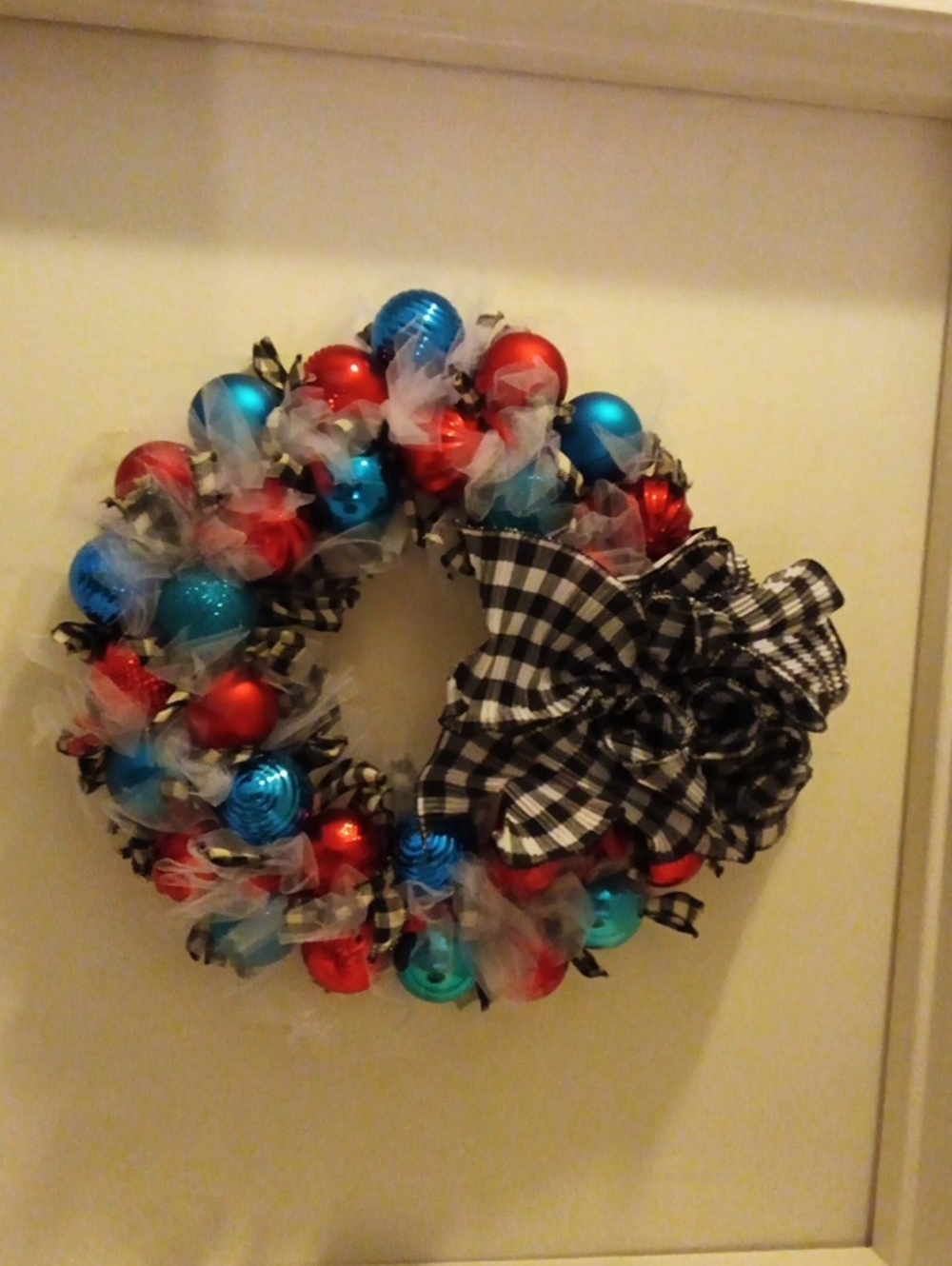 Festive Red & Blue Ornament Holiday Wreath with Black Gingham Bow